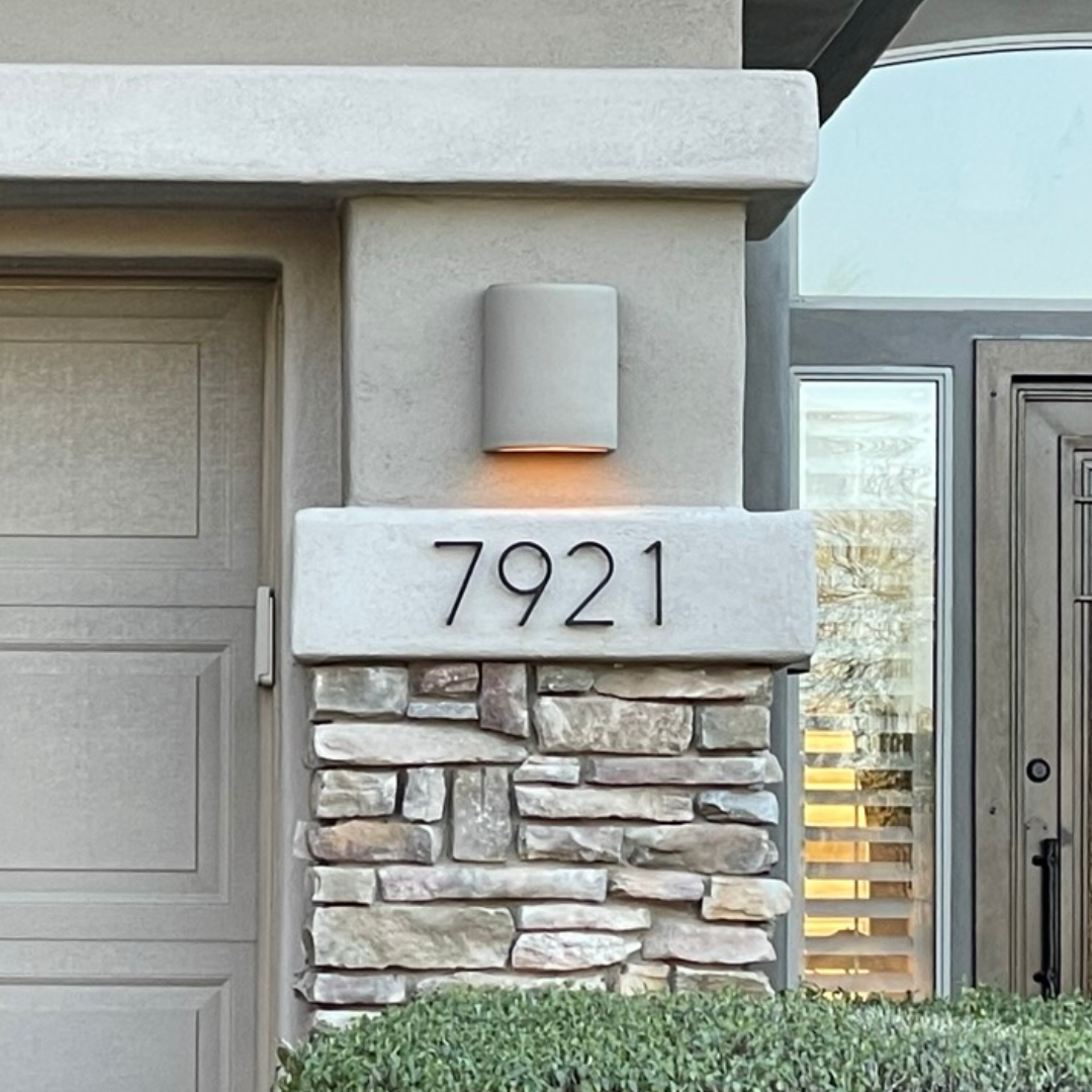 floating numbers under a light fixture