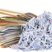 folders full of paper and shredded paper