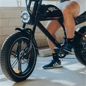 legs on motorized bike