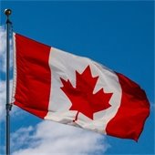 canadian flag with a blue sky background