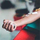 the arm of someone having blood drawn