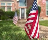 US flag in front of a home