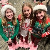 Girls at a santa party in PJs