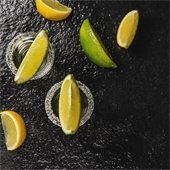 lemons and limes on a black background