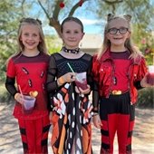 three girls in costumes