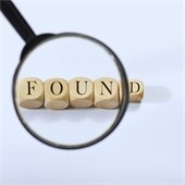 magnifying glass over blocks that spell "found"