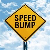 speed bump traffic sign against the sky