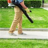 legs of a man blowing leaves