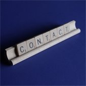 the word "contact" written with tile letters