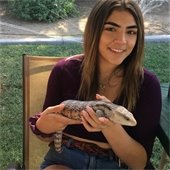 girl holding a creature