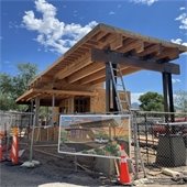 guardhouse construction with banner in front showing the final schematic