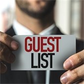 Guest List card in man's hands