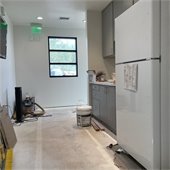 refrigerator and gray cabinets 