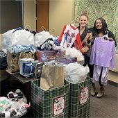 Cierra and Sarah holding pajamas