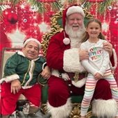 girl with santa and an elf